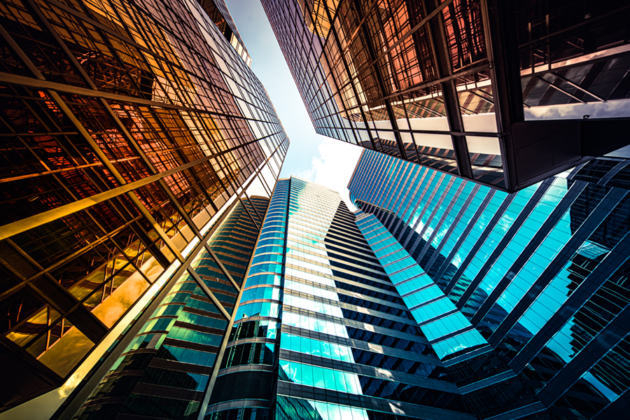 Co-Investments - banner image -Upward view of city buildings